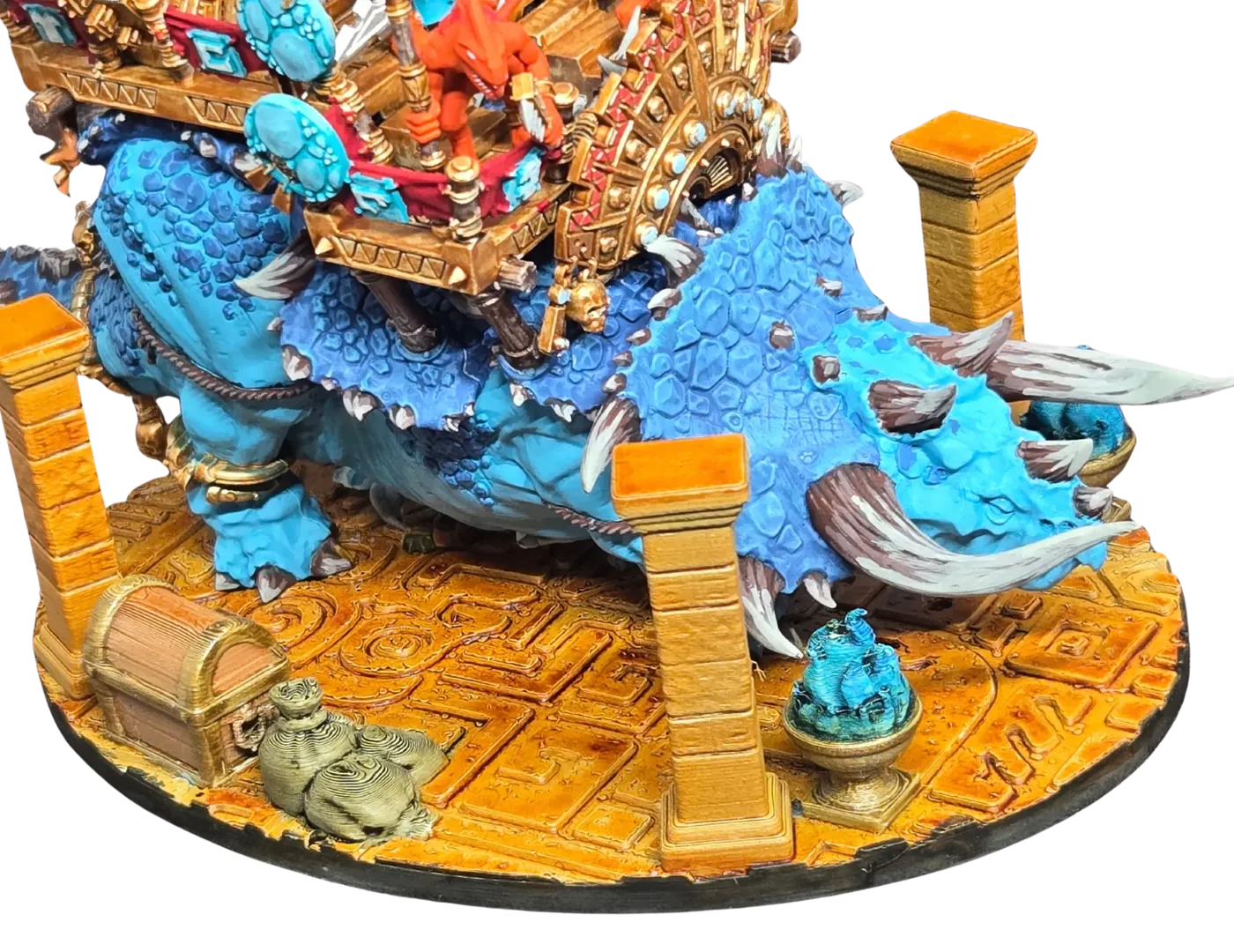 Painted miniature on a Temple base with gold pillars and a treasure chest, designed in Base Crafter